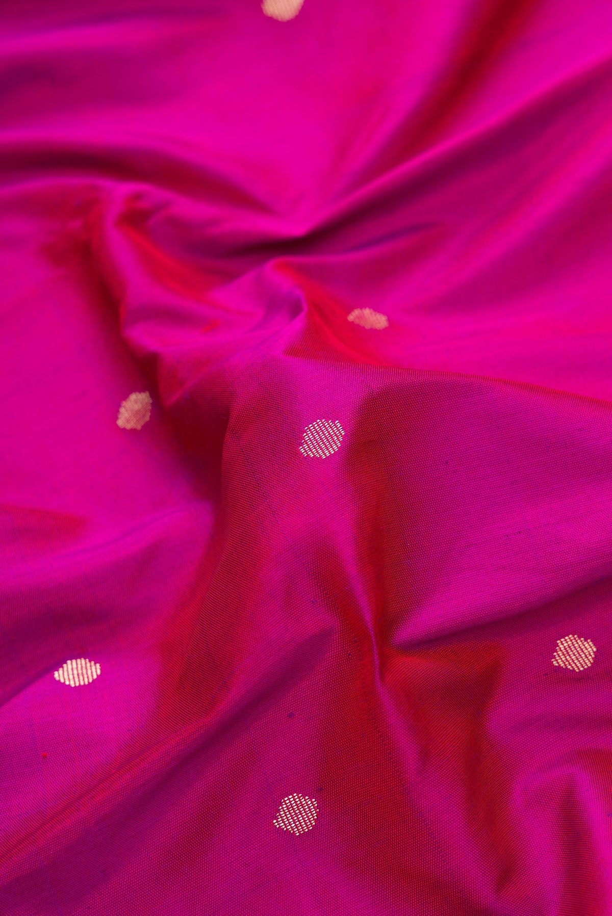 Close up of Purple Dual Tone Paithani Silk Saree with Zari Butta on the body and Paithani Border.  displaying folds