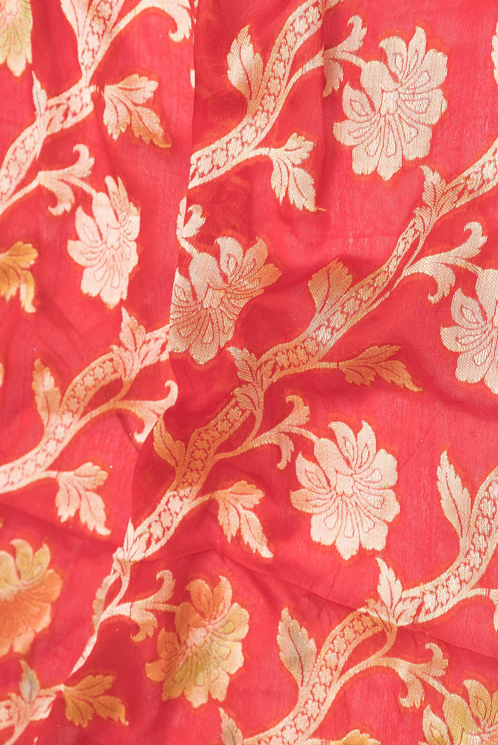 Close up of Red Dual Tone Georgette Saree with Zari Brocade on the body and Zari Border displaying folds