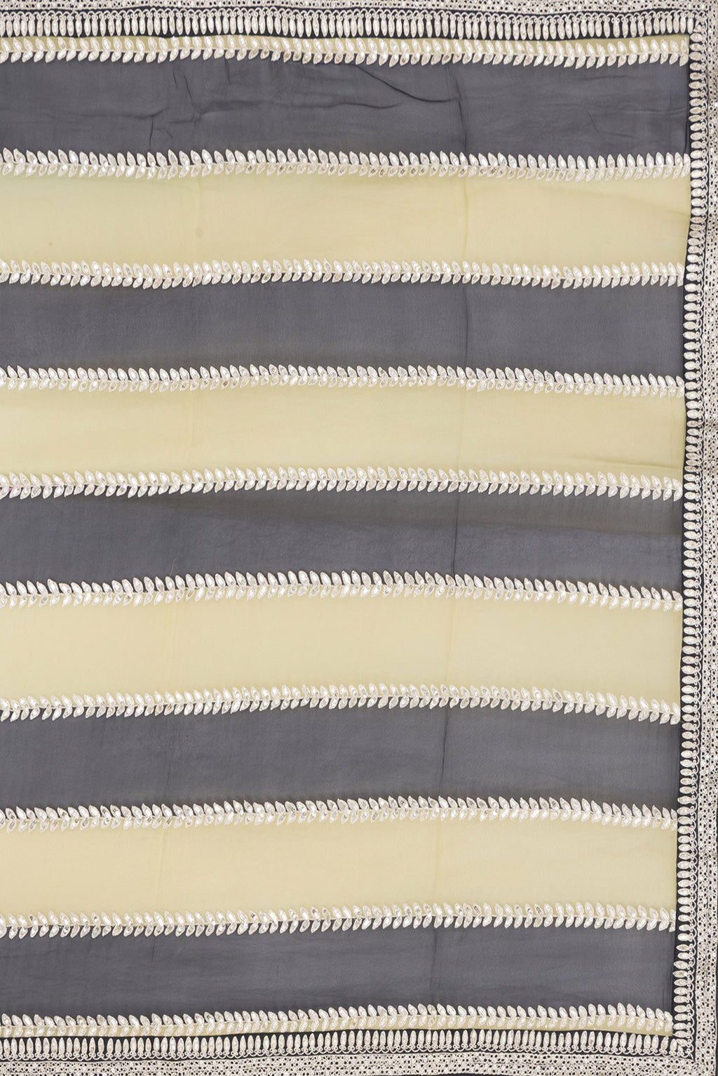Close up image of the pallu of Green and Black Color Mysore Georgette Saree with Embroidery on the body and Embroidery Border. 