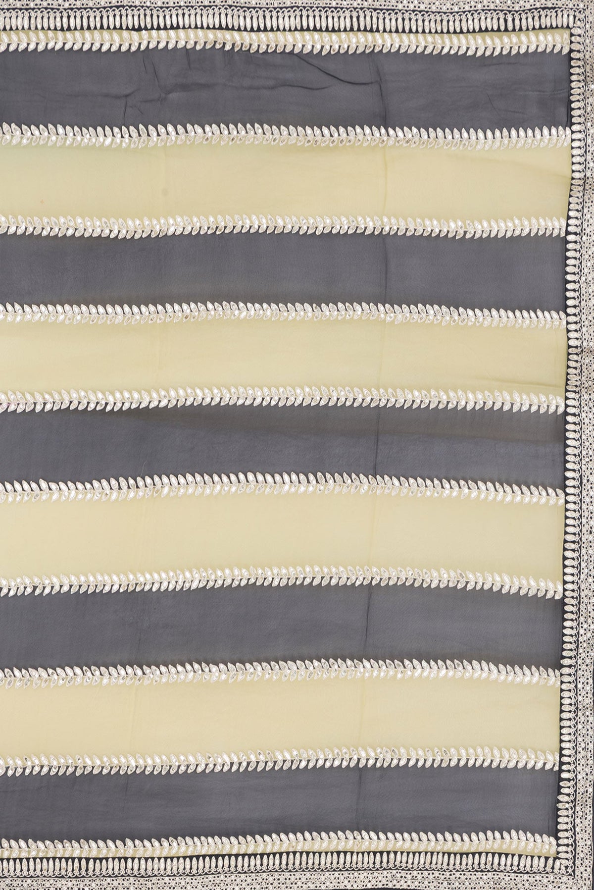 Close up image of the pallu of Green and Black Color Mysore Georgette Saree with Embroidery on the body and Embroidery Border. 