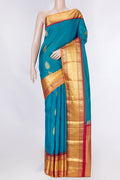 Peacock Blue Dual Tone Kanchipuram Saree with Zari Butta on the body and Zari Border displayed on a mannequin