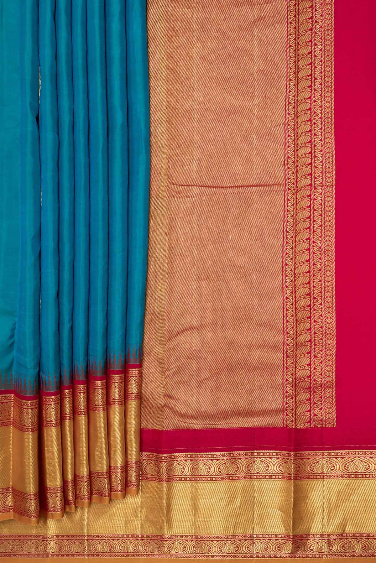 Pleats and pallu of Peacock Blue Dual Tone Kanchipuram Saree with Zari Butta on the body and Zari Border