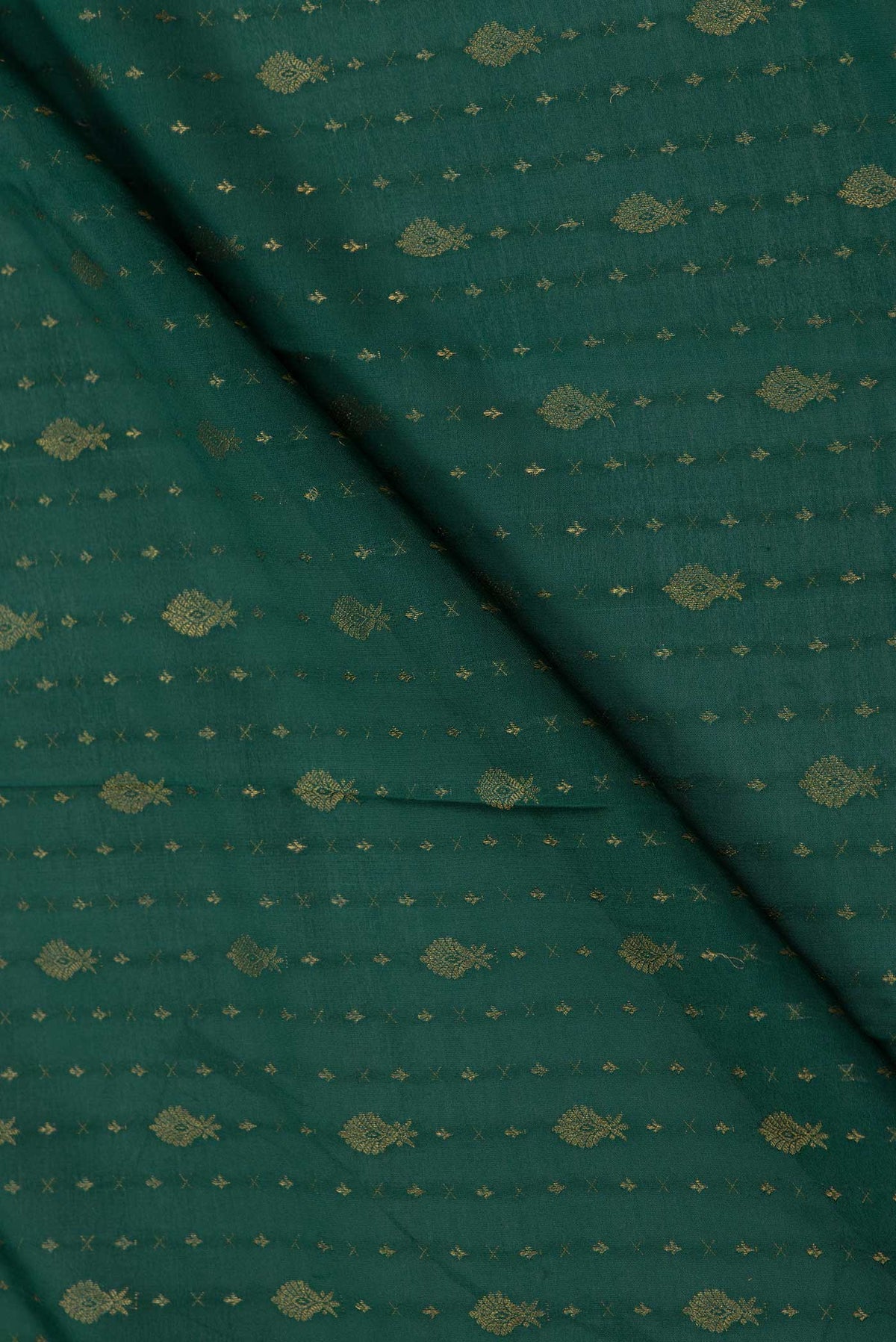 Close up of Green Dual Tone Mysore Crepe Saree with Zari Butta on the body and Zari Border displaying folds