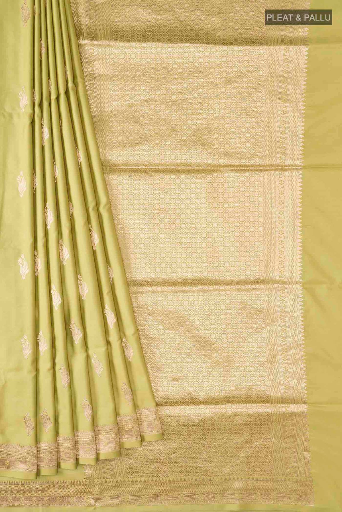 Pleats and pallu of Green Banarasi Silk Saree with Zari Butta on the body and Zari Border