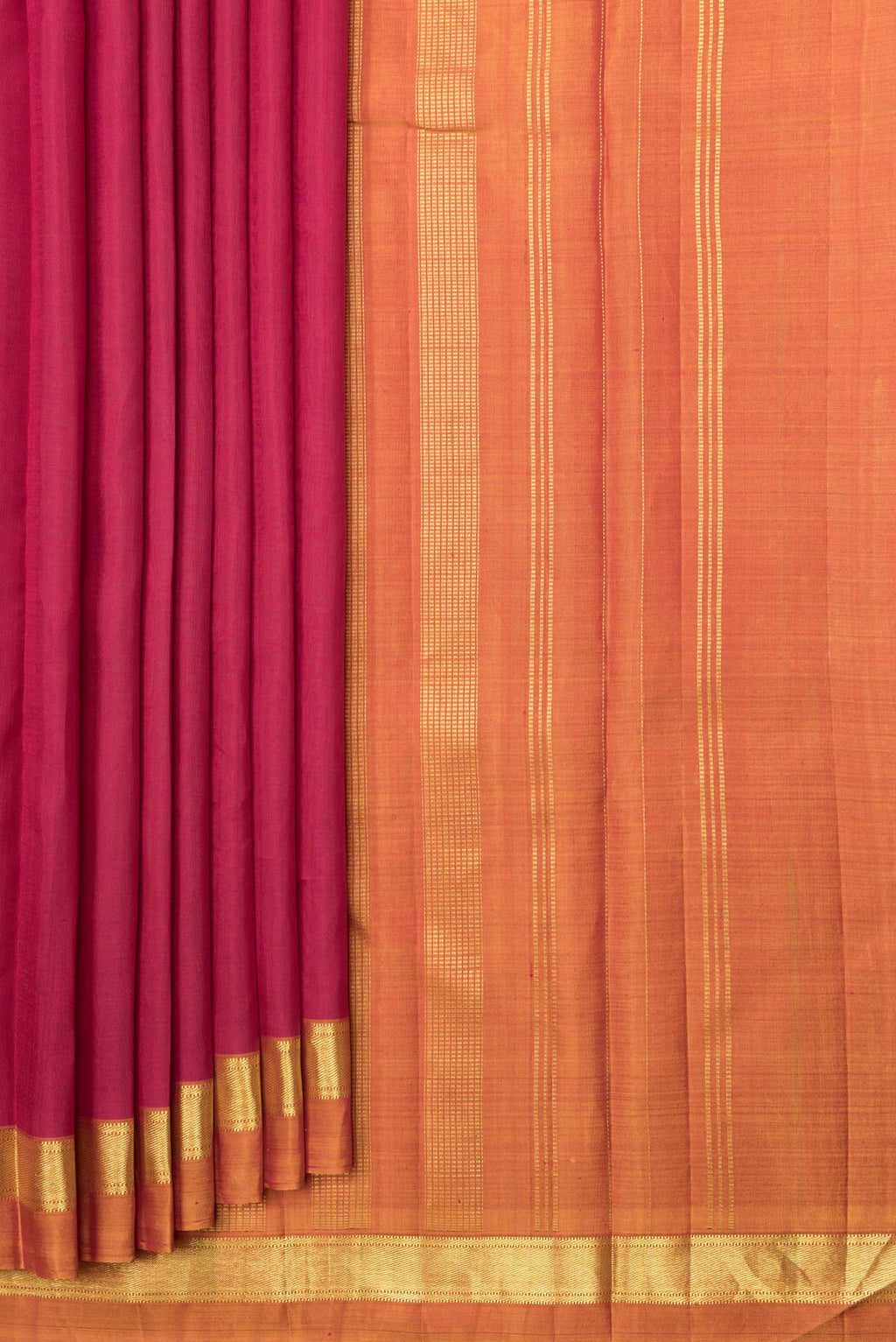 Pleats and pallu of Maroon Dual Tone Kanjivaram Saree with Plain Body and Zari Border. 
