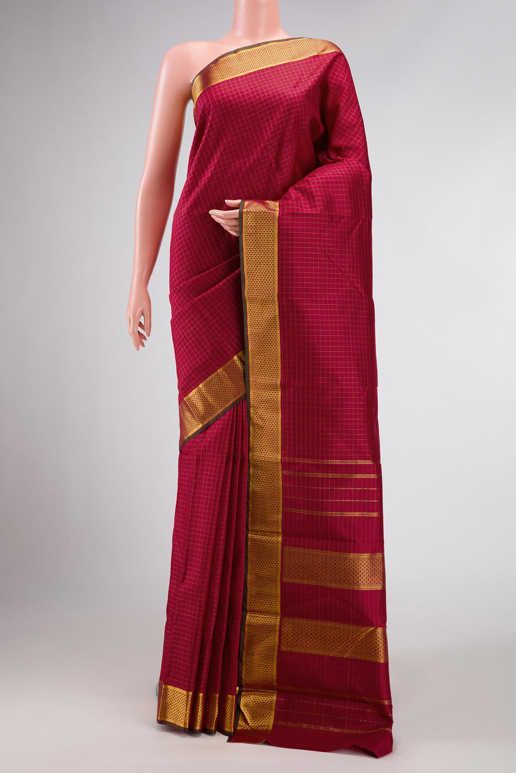 Maroon Dual Tone Kanchipuram Silk Saree with Checked design on the body and Zari Border.  displayed on a mannequin