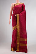 Maroon Dual Tone Kanchipuram Silk Saree with Checked design on the body and Zari Border.  displayed on a mannequin