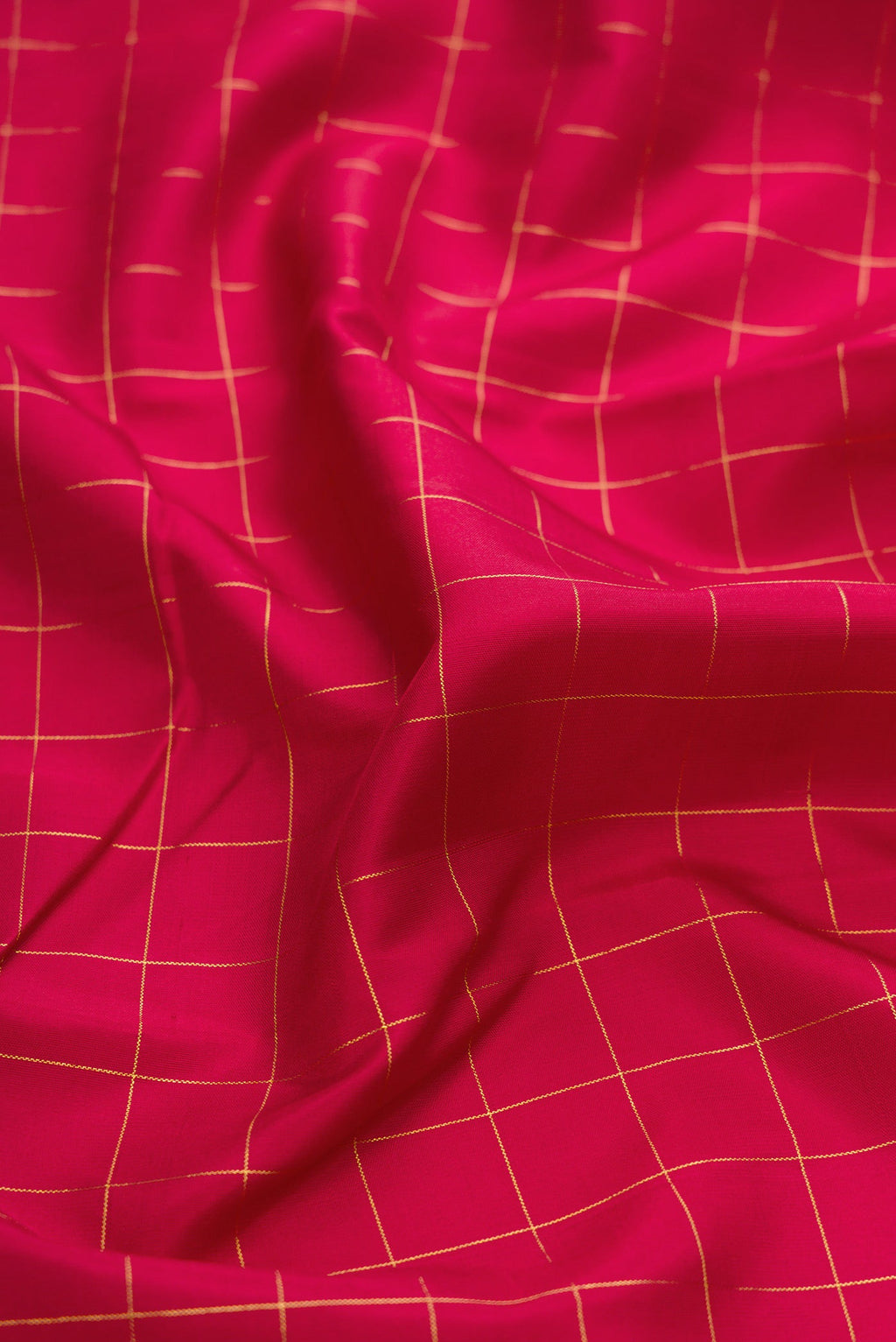 Close up of Maroon Kanchipuram Silk Saree with Checked design on the body and Fancy Border.  displaying folds