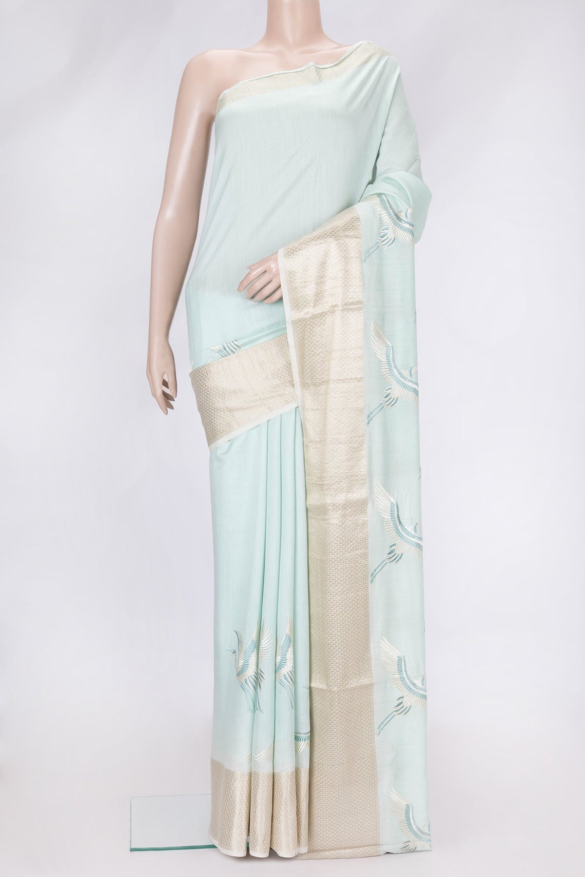 Light Blue Dual Tone Tussar Silk Saree with Plain Body and Fancy Border.  displayed on a mannequin