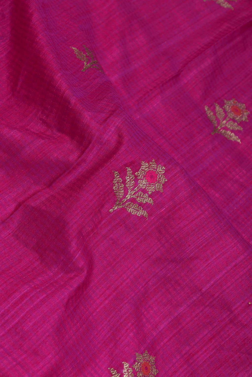 Close up of Pink Dual Tone Raw Silk Saree with Zari Butta on the body and Zari Border displaying folds