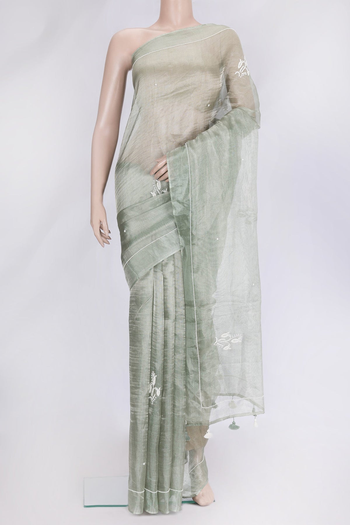 Pista Green Dual Tone Organza Silk Saree with Embroidery on the body and Embroidery Border.  displayed on a mannequin
