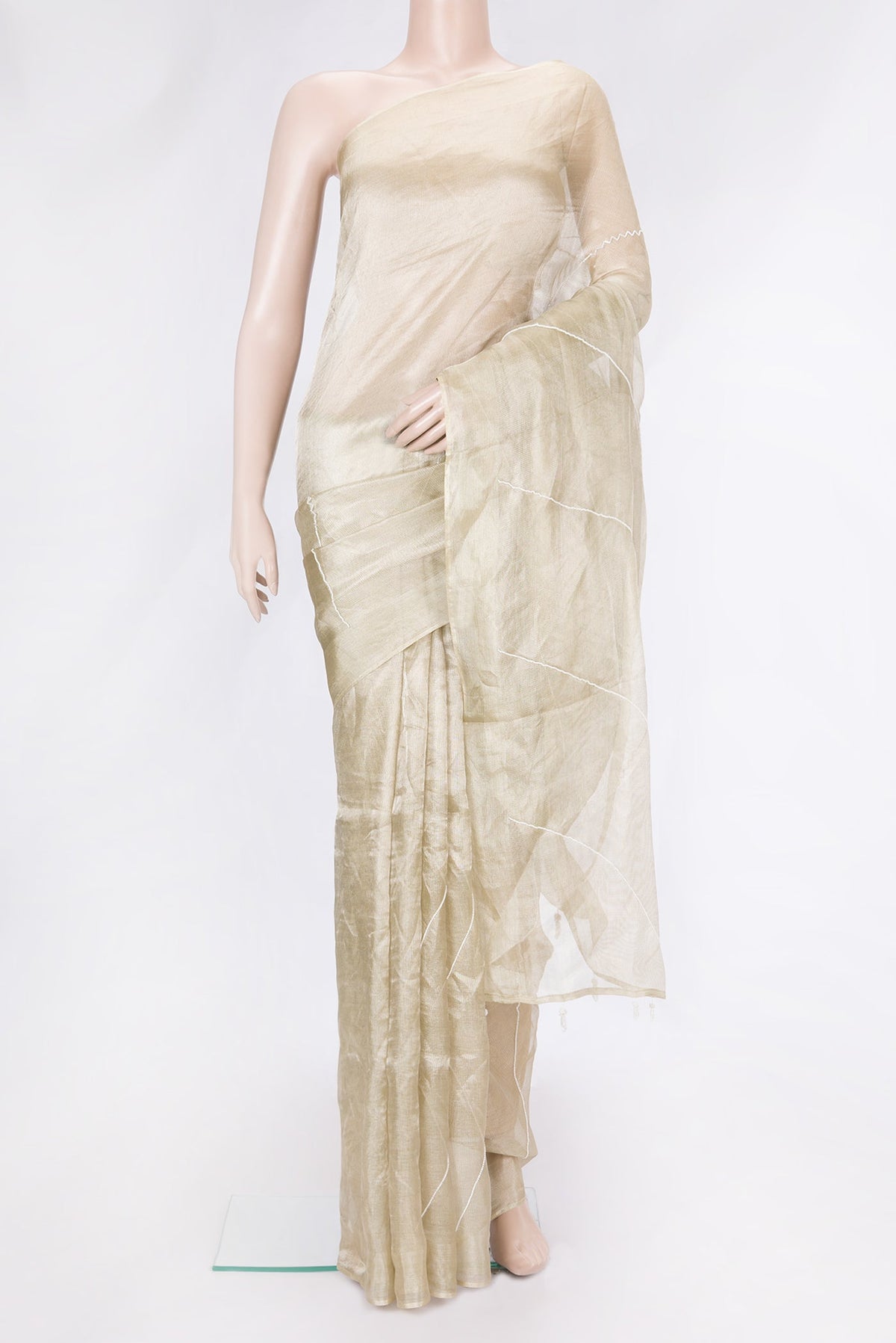 Beige Dual Tone Organza Silk Saree with Embroidery on the body and Without Border.  displayed on a mannequin