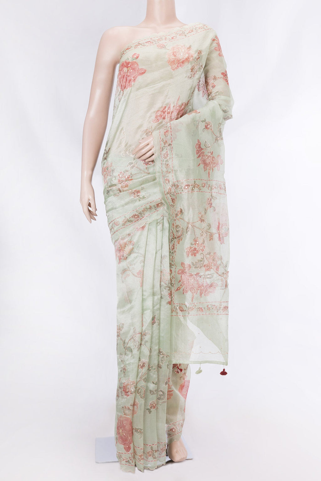 Pista Green Dual Tone Organza Silk Saree with Embroidery on the body and Embroidery Border displayed on a mannequin