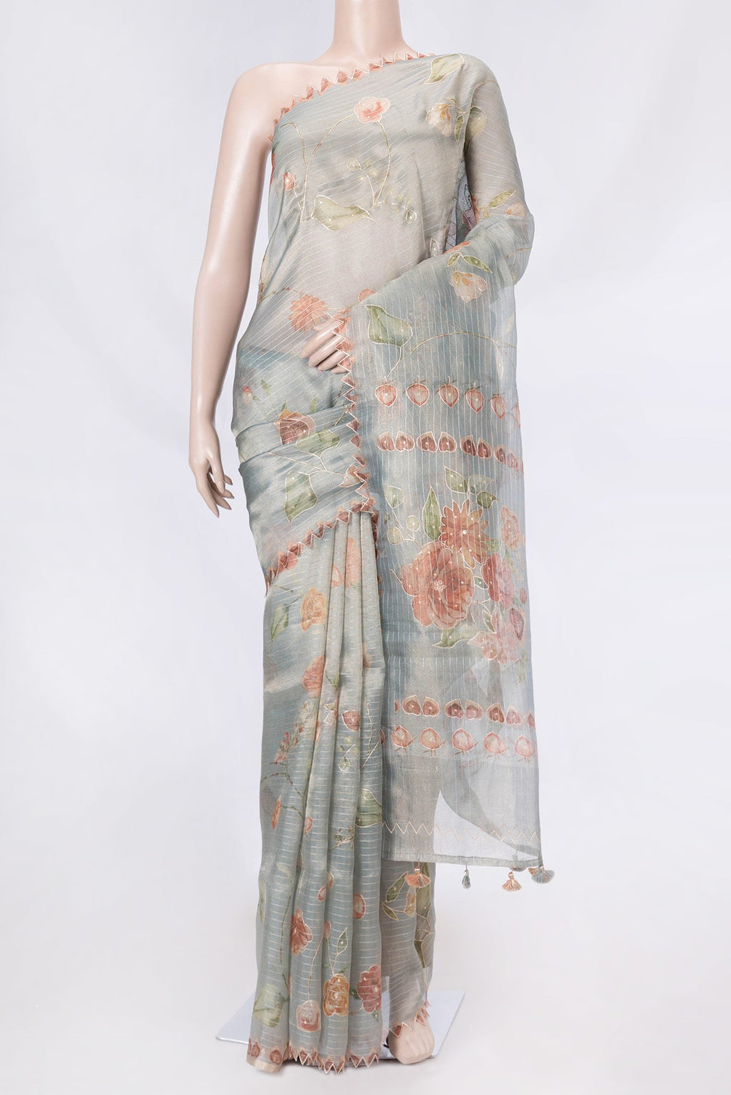 Blue Grey Organza Silk Saree with Embroidery on the body and Embroidery Border displayed on a mannequin