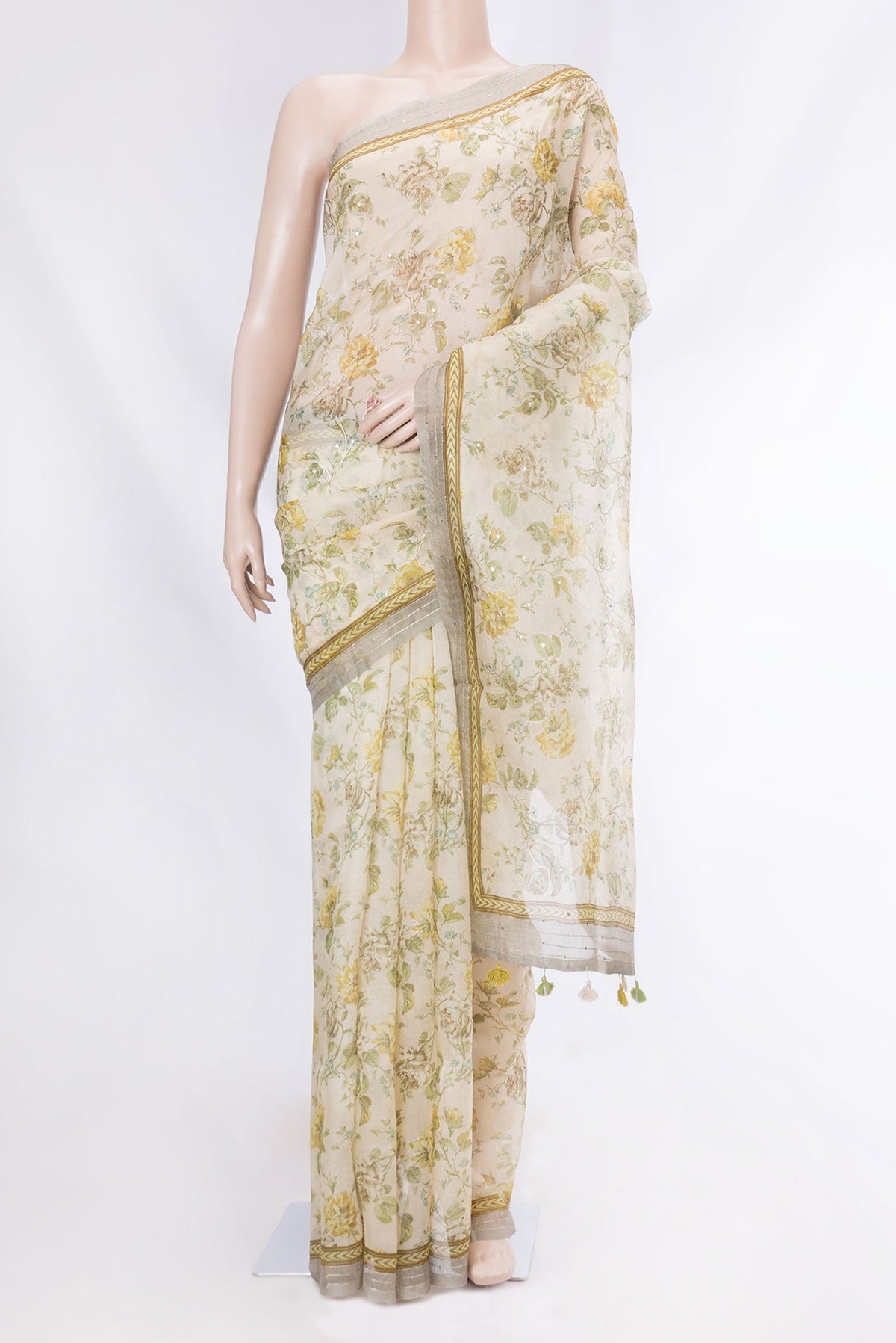 Cream Organza Silk Saree with Floral Print on the body and Embroidery Border displayed on a mannequin