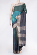 Mustard and Peakcock Blue Color Tussar Silk Saree with Printed design on the body and Zari Border.  displayed on a mannequin