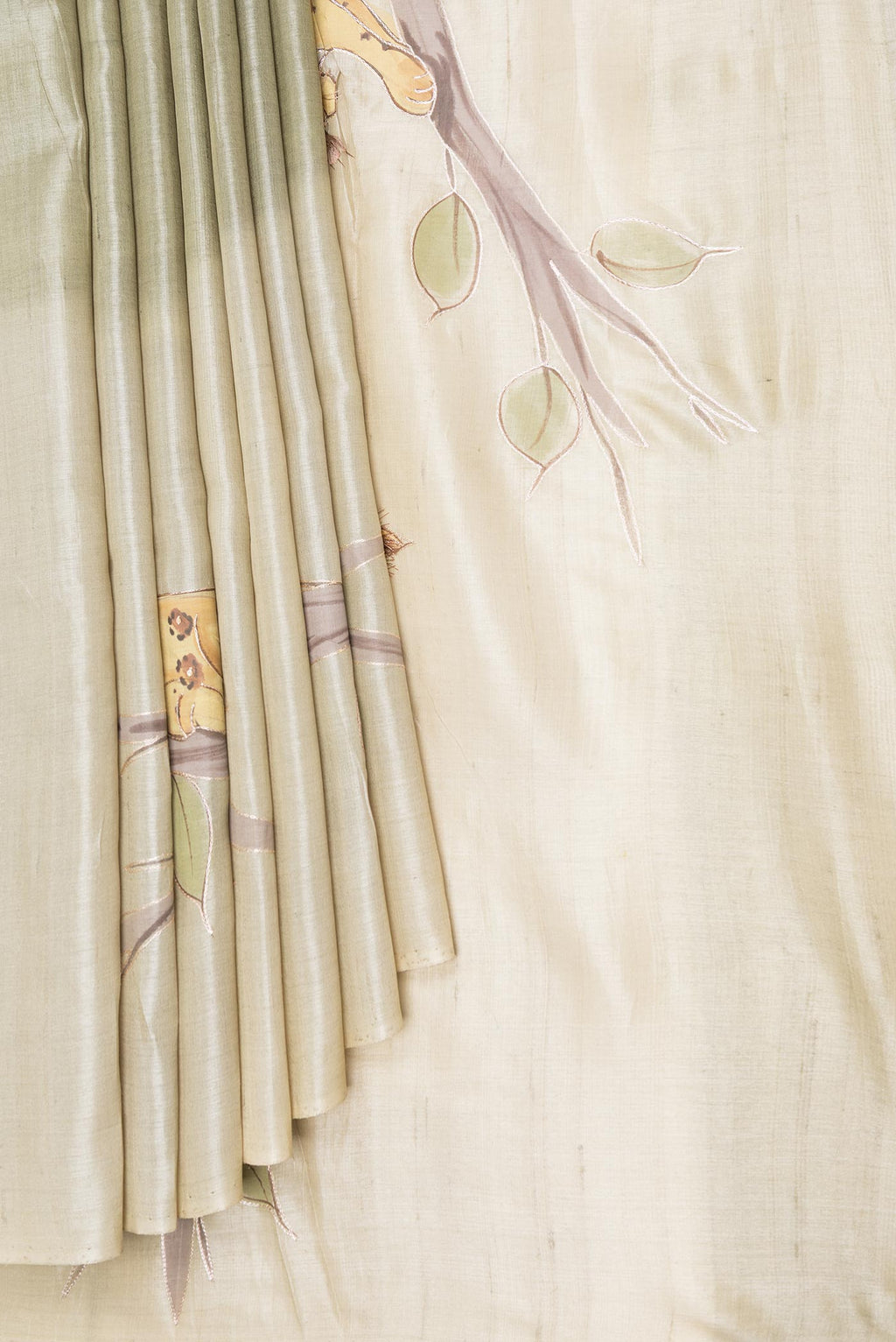 Pleats and pallu of Green Dual Tone Tussar Saree with Zari And Thread Butta on the body and Without Border