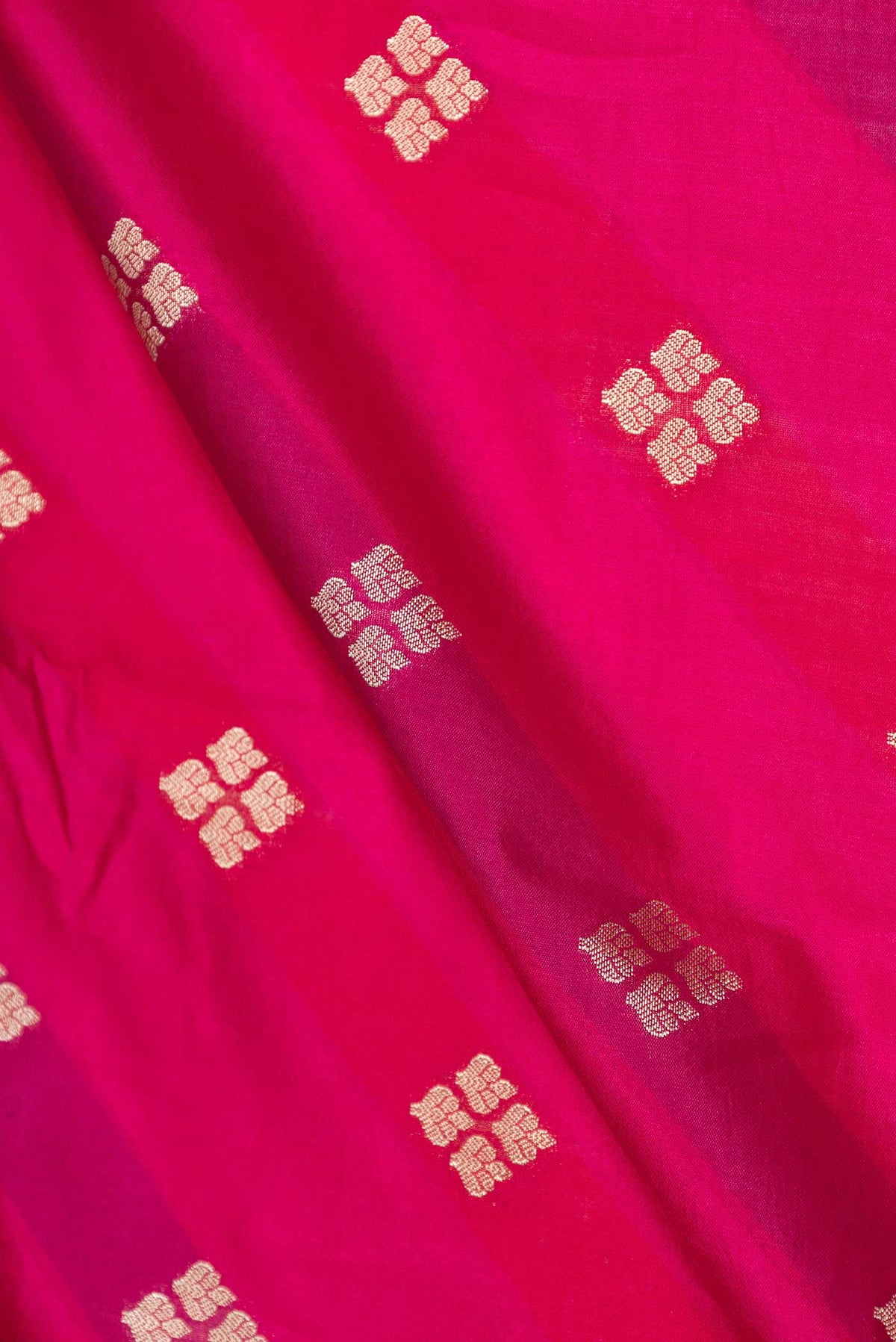 Close up of Pink Banarasi Raw Silk Saree with Zari Butta on the body and Zari Border displaying folds