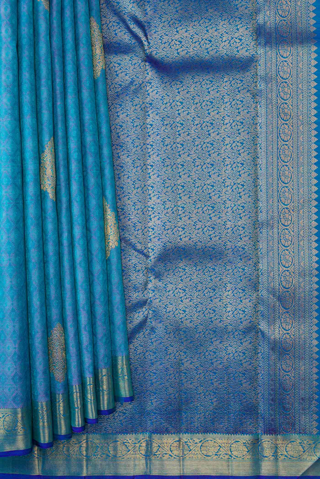 Pleats and pallu of Pure Silk Pure Zari Peacock Blue Dual Tone Kanchipuram Saree with Jacquard With Zari Butta on the body and Zari Border. 