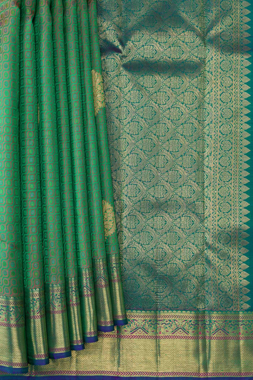 Pleats and pallu of Pure Silk Pure Zari Green Dual Tone Kanchipuram Saree with Jacquard With Zari Butta on the body and Zari Border. 