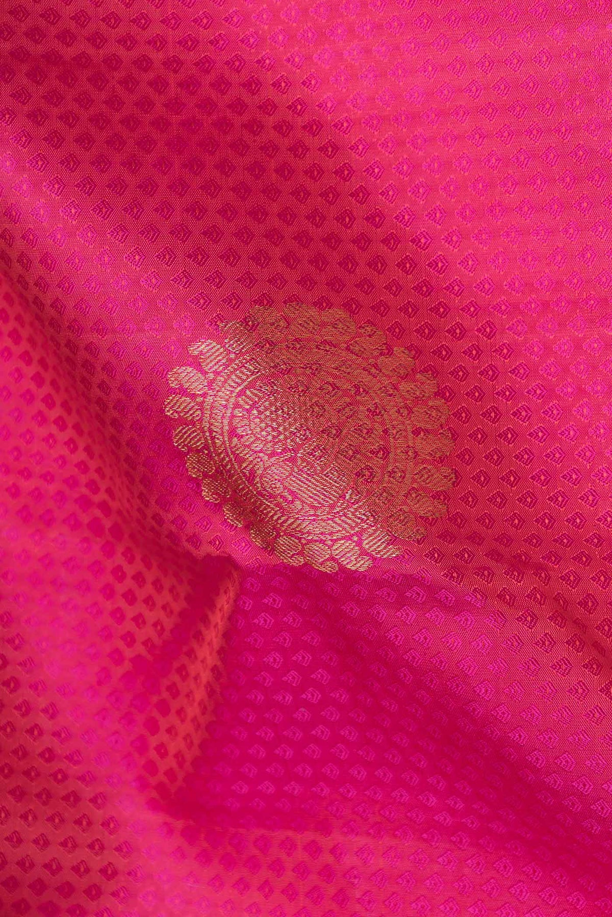 Close up of Pink Dual Tone Kanchipuram Saree with Jacquard With Zari Butta on the body and Zari Border displaying folds
