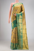 Gold Dual Tone Kanchipuram Tissue Silk Saree with Zari Brocade on the body and Zari Border.  displayed on a mannequin
