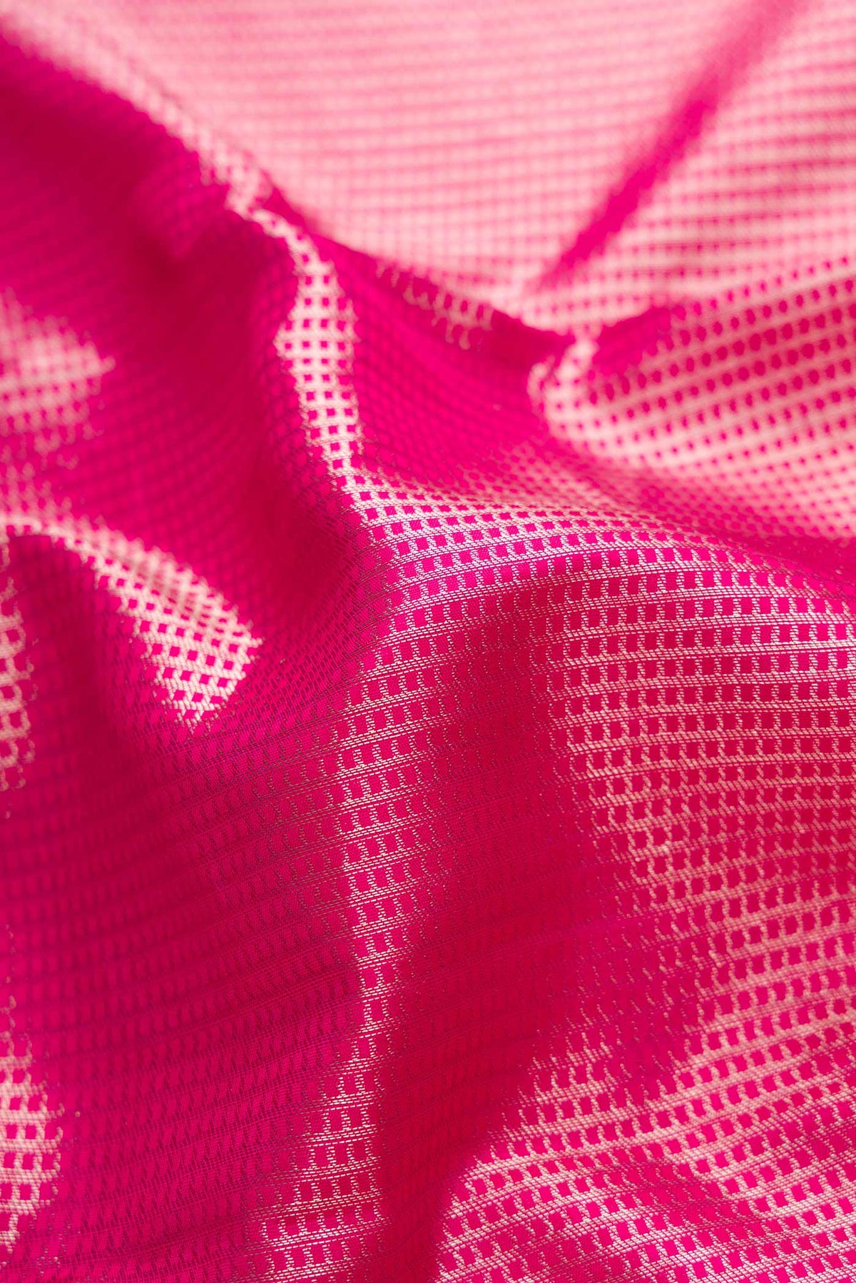 Close up of Pink Dual Tone Kanchipuram Saree with Zari Brocade on the body and Zari Border displaying folds