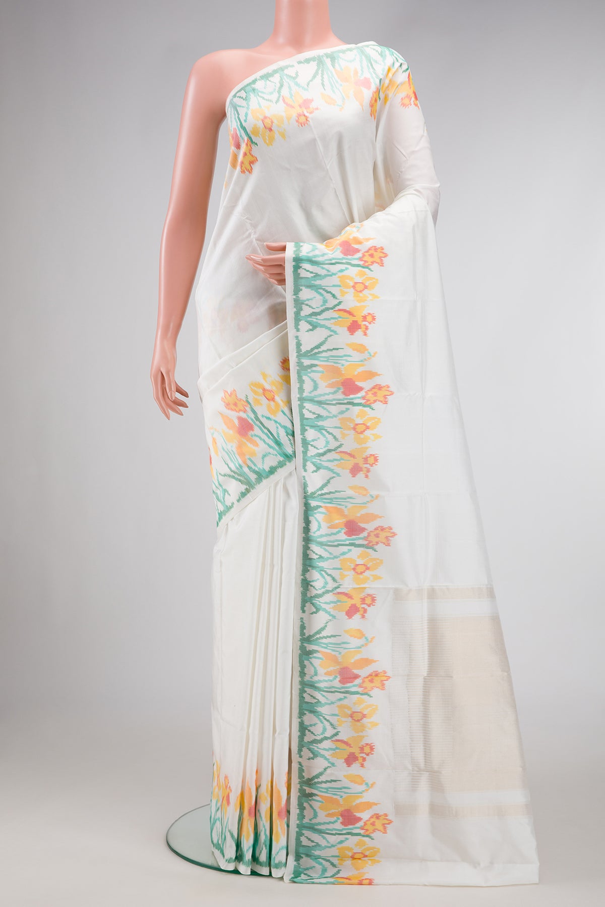 White Double Ikat Saree with Plain Body and Ikat Border.  displayed on a mannequin