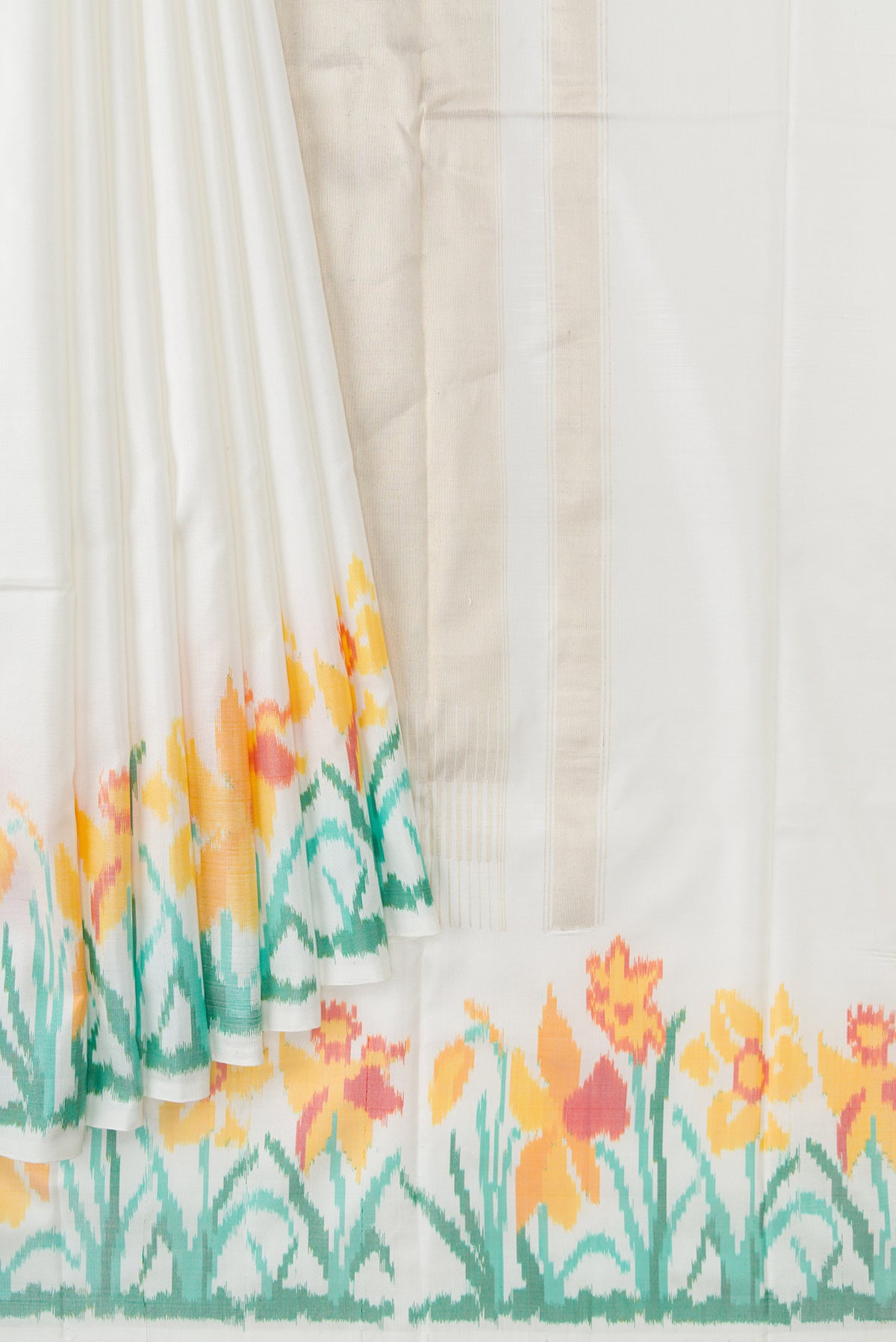 Pleats and pallu of White Double Ikat Saree with Plain Body and Ikat Border. 