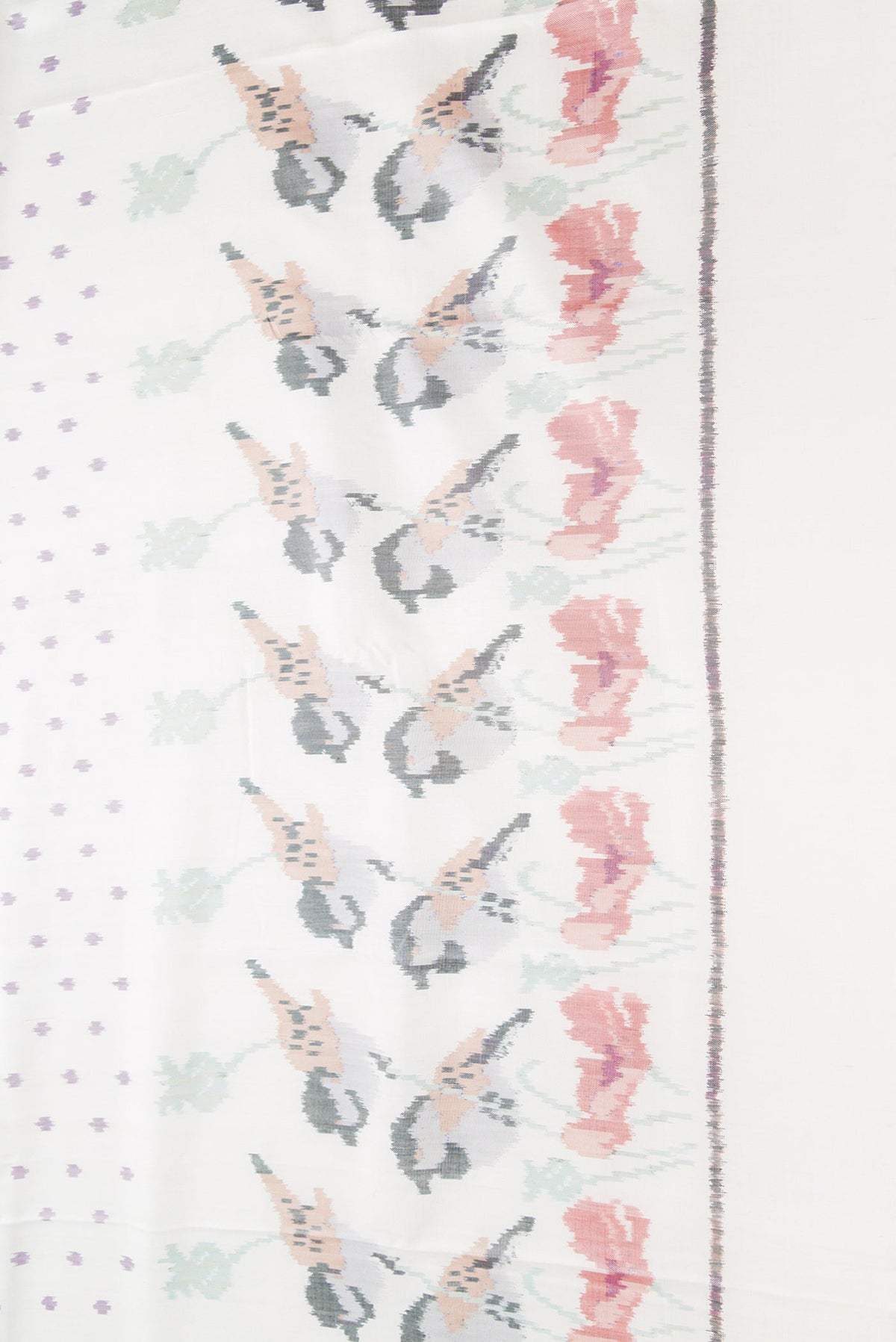 Border image of White Dual Tone Rajkot Patola Silk Saree with Ikat Print on the body and Ikat Border. 