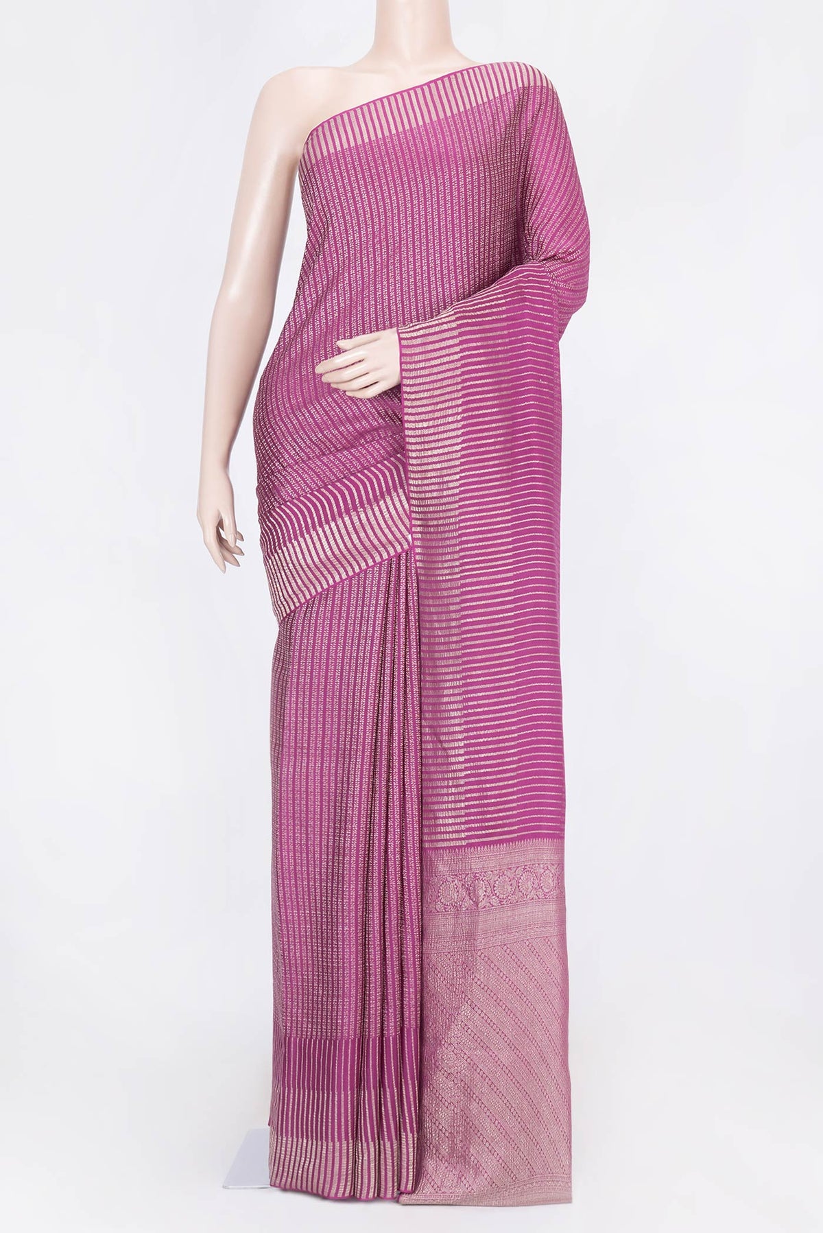 Magenta Mysore Crepe Saree with Stripes on the body and Zari Border displayed on a mannequin
