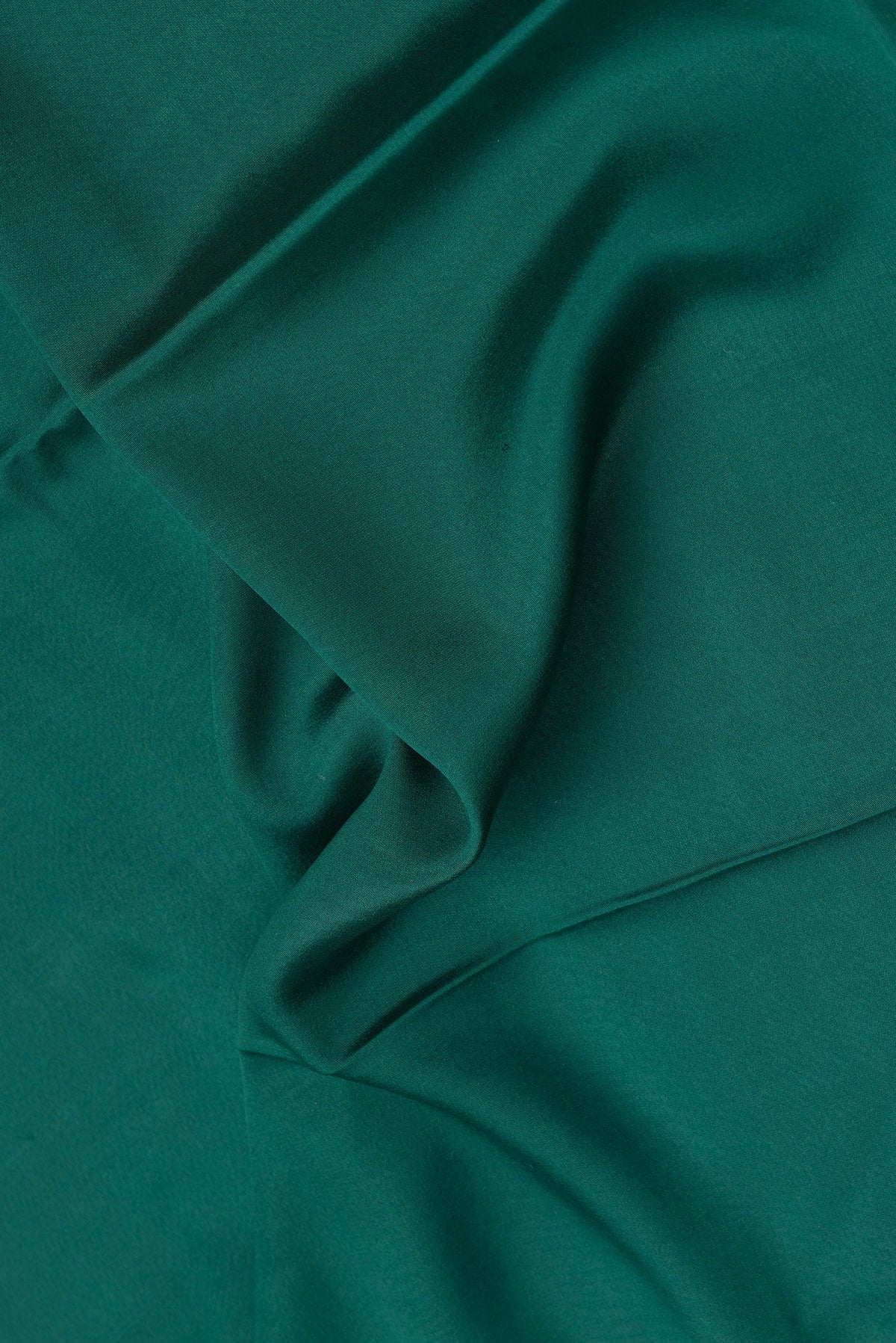 Close up of Bottle Green Dual Tone Mysore Crepe Saree with Plain Body and Fancy Border.  displaying folds