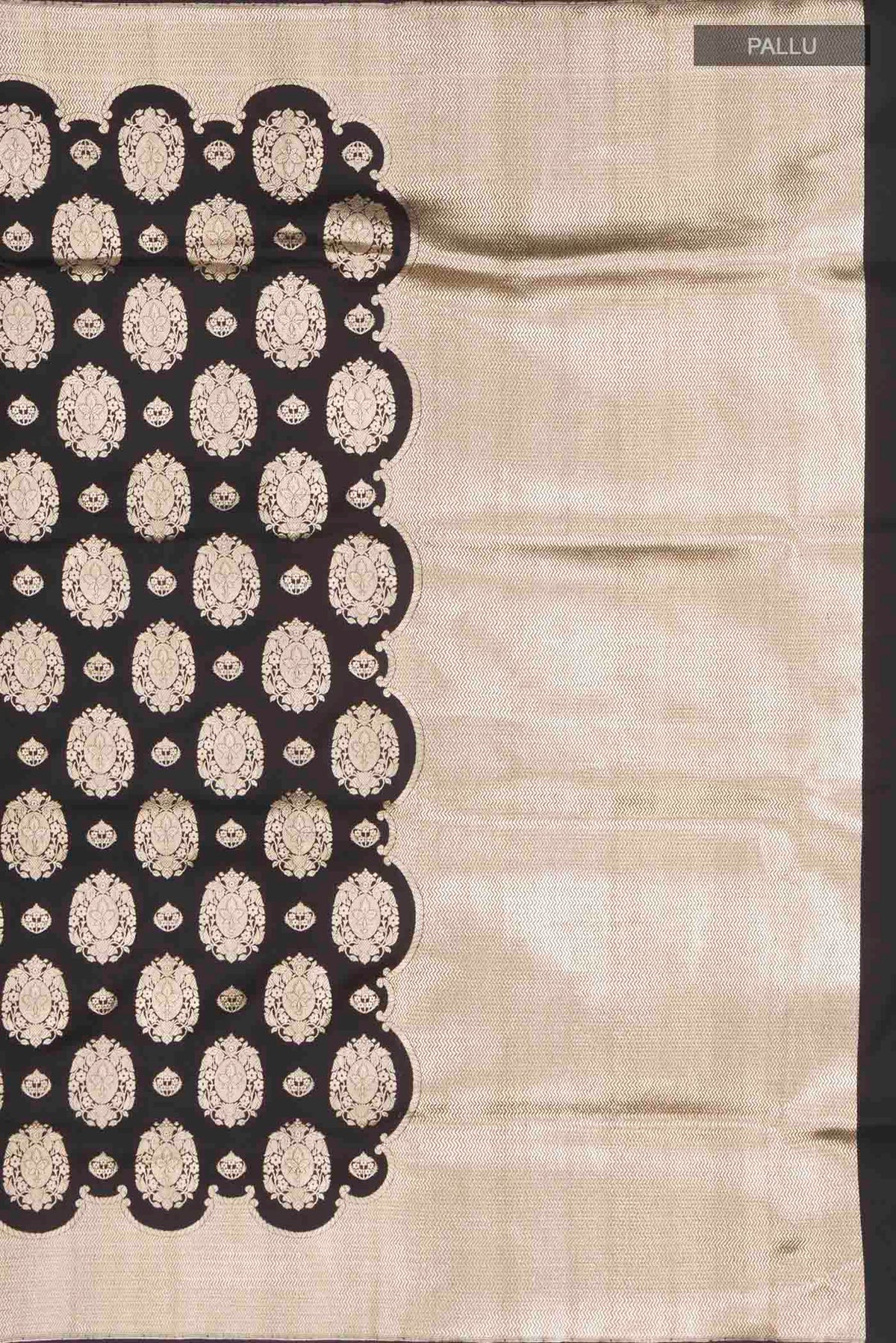 Close up image of the pallu of Black Banarasi Silk Saree with Zari Butta on the body and Zari Border