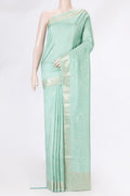 Sea Green Tussar Silk Saree with Zari Butta on the body and Zari Border.  displayed on a mannequin