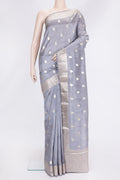 Grey Dual Tone Tussar Silk Saree with Zari Butta on the body and Zari Border.  displayed on a mannequin
