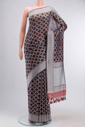 Brown Banarasi Georgette Saree with Thread Butta on the body and Thread Border displayed on a mannequin