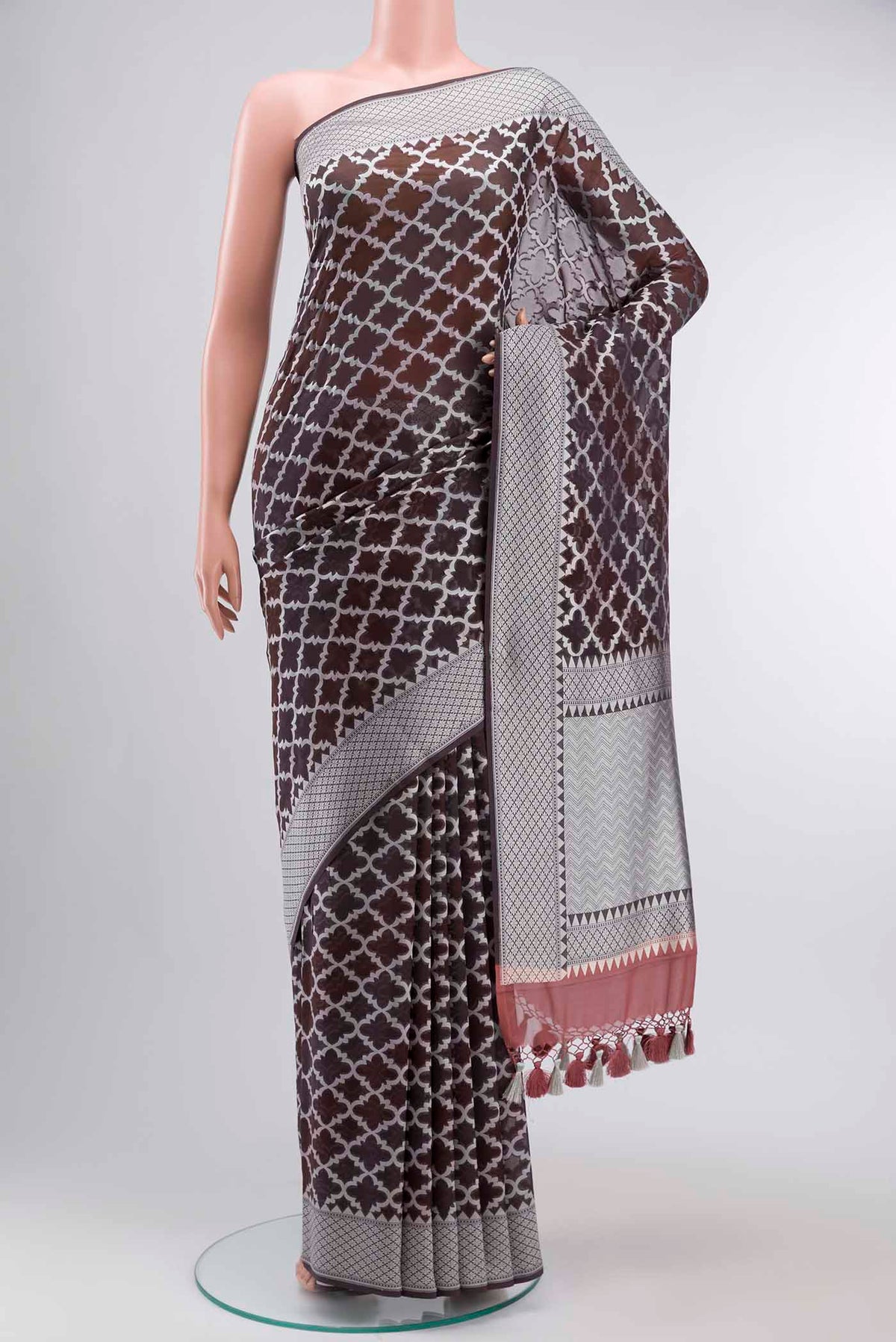 Brown Banarasi Georgette Saree with Thread Butta on the body and Thread Border displayed on a mannequin