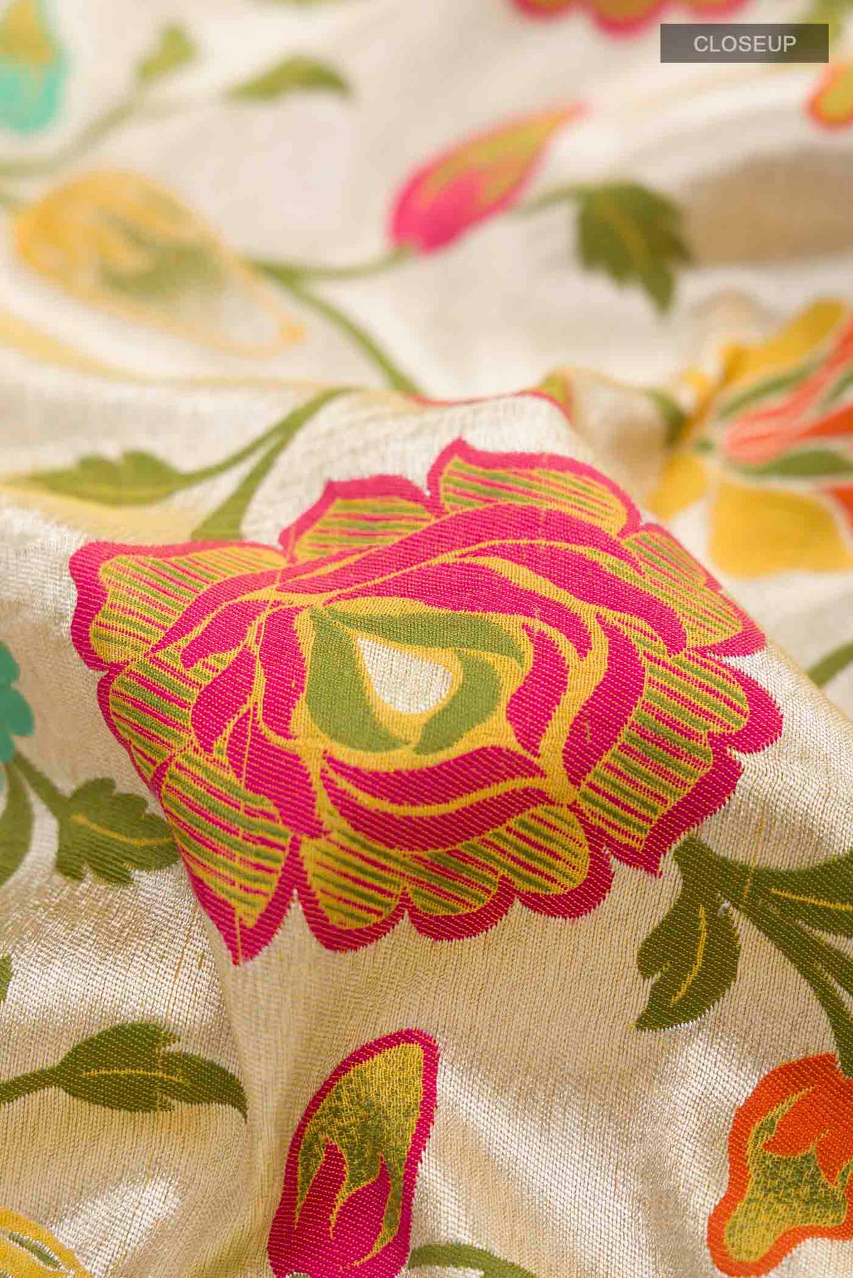 Close up of Yellow Banarasi Georgette Saree with Zari And Thread Butta on the body and Zari Border displaying folds