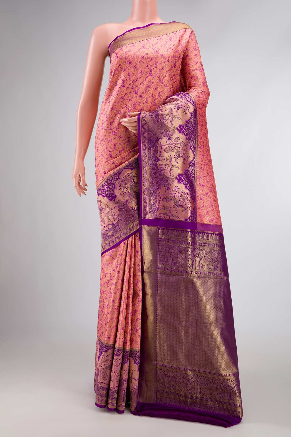 Golden Peach Dual Tone Kanchipuram Silk Saree with Zari Brocade on the body and Fancy Border displayed on a mannequin