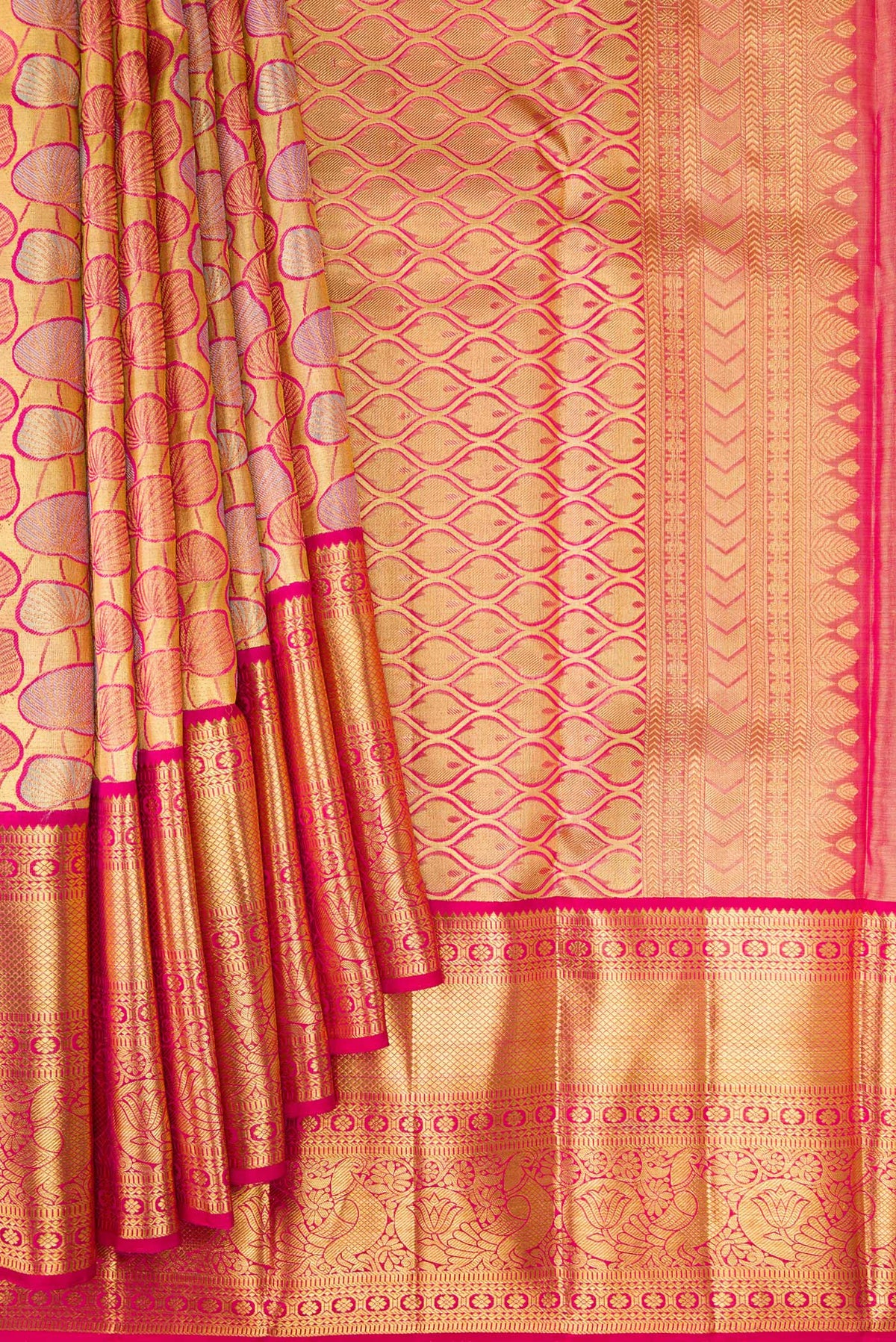 Pleats and pallu of Gold Dual Tone Kanchipuram Tissue Silk Saree with Zari Brocade on the body and Zari Border. 