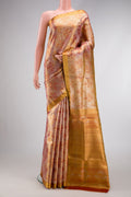 Gold Dual Tone Kanjivaram Tissue Silk Saree with Zari Brocade on the body and Zari Border.  displayed on a mannequin