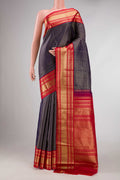 Navy Blue Dual Tone Kanchipuram Silk Saree with Checked design on the body and Zari Border displayed on a mannequin