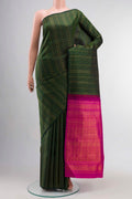 Green Kanchipuram Silk Saree with Stripes on the body and Without Border displayed on a mannequin