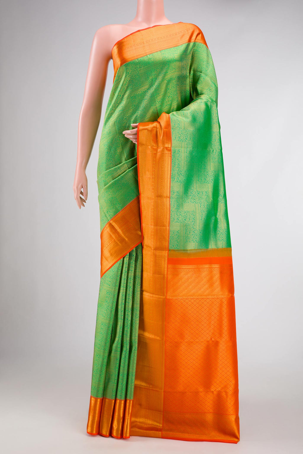Parrot Green Dual Tone Kanchipuram Silk Saree with Zari Brocade on the body and Zari Border.  displayed on a mannequin