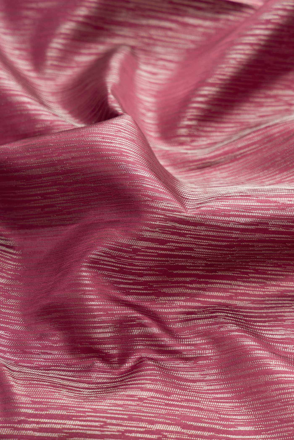 Close up of Dark Mauve Dual Tone Kanchipuram Silk Saree with Zari Brocade on the body and Zari Border displaying folds