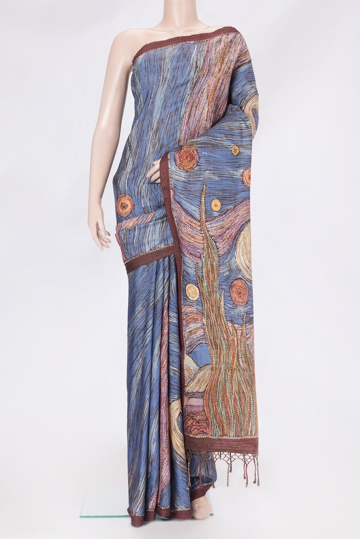 Blue Tussar Silk Saree with Embroidery on the body and Embroidery Border.  displayed on a mannequin
