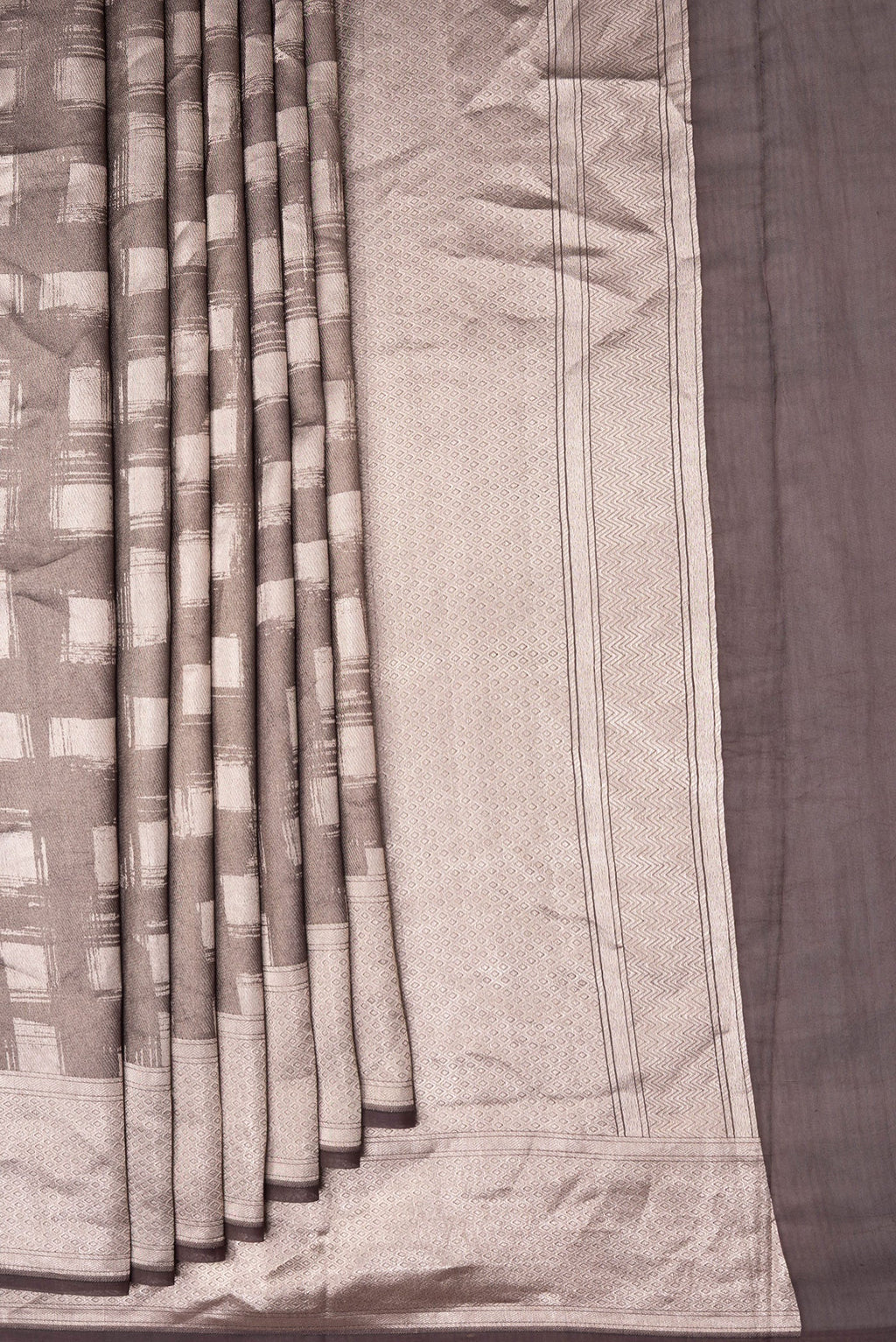 Pleats and pallu of Brown Dual Tone Banarasi Silk Saree with Zari Brocade on the body and Zari Border. 