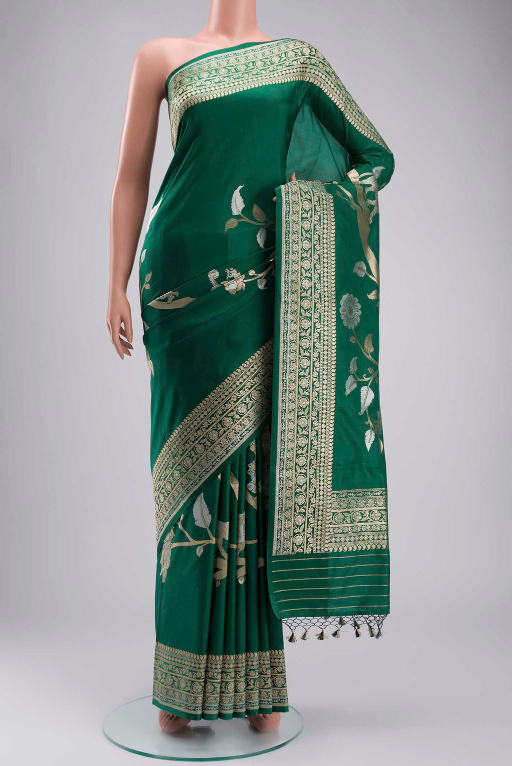Green Banarasi Silk Saree with Zari Butta on the body and Zari Border displayed on a mannequin