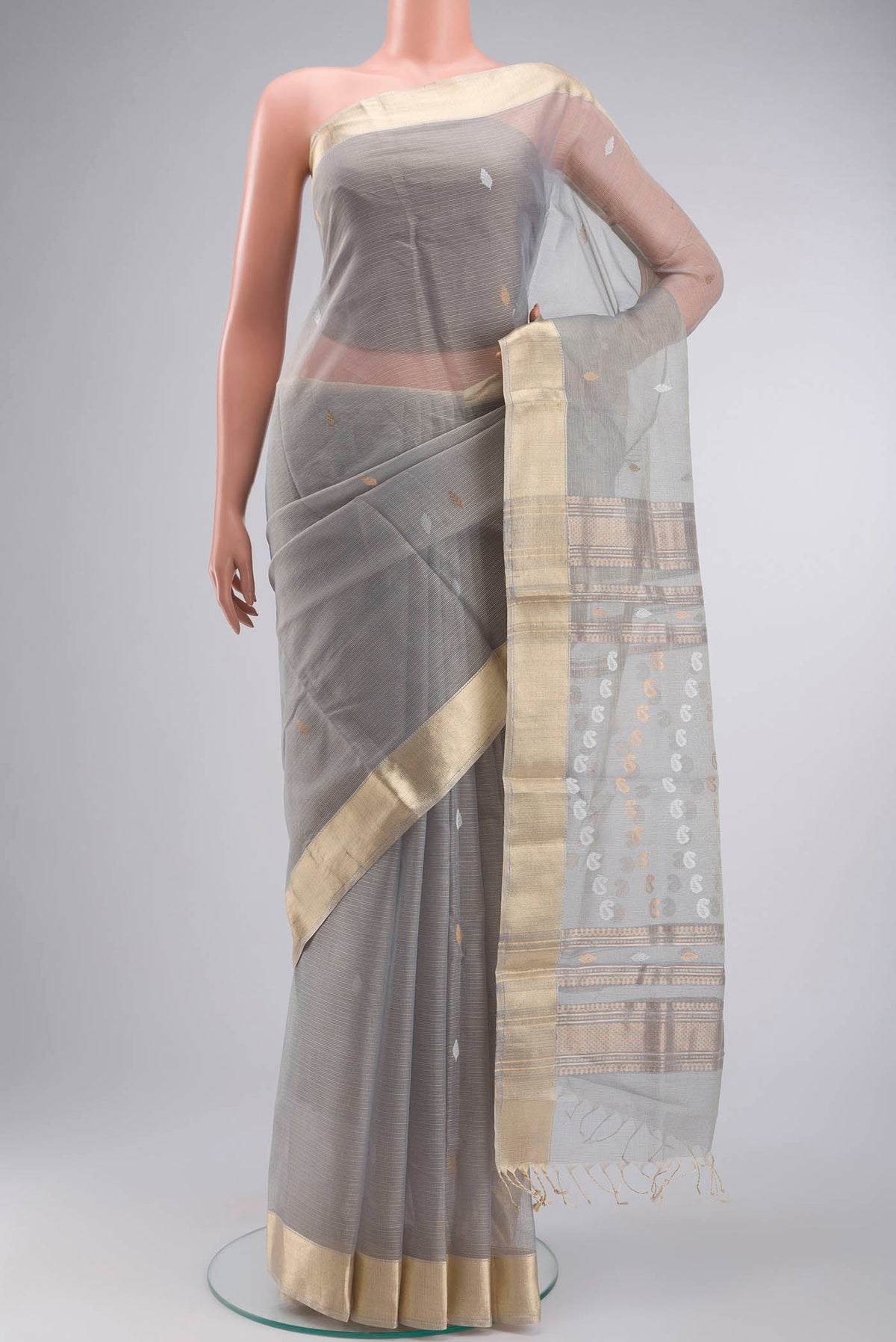 Grey Maheshwari Silk Cotton Saree with Zari Butta on the body and Zari Border displayed on a mannequin