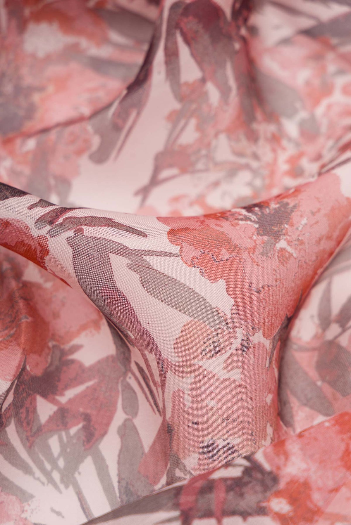 Close up of Pink Dual Tone Organza Silk Saree with Printed design on the body and Plain Border.  displaying folds